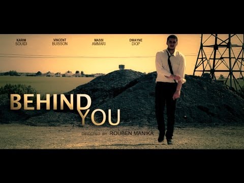 BEHIND YOU